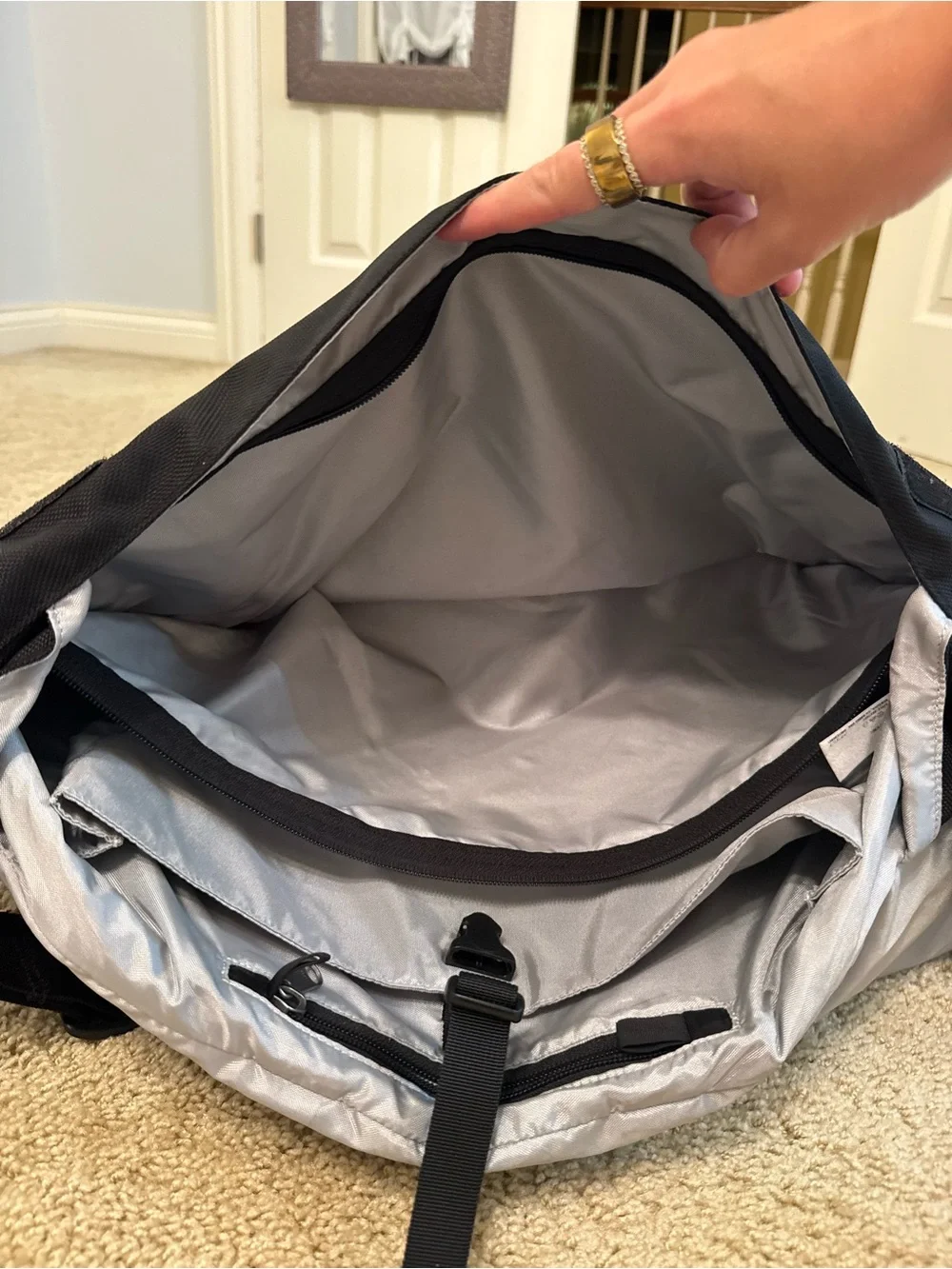 Patagonia Black Messenger Bag with Silver Reflective Strip